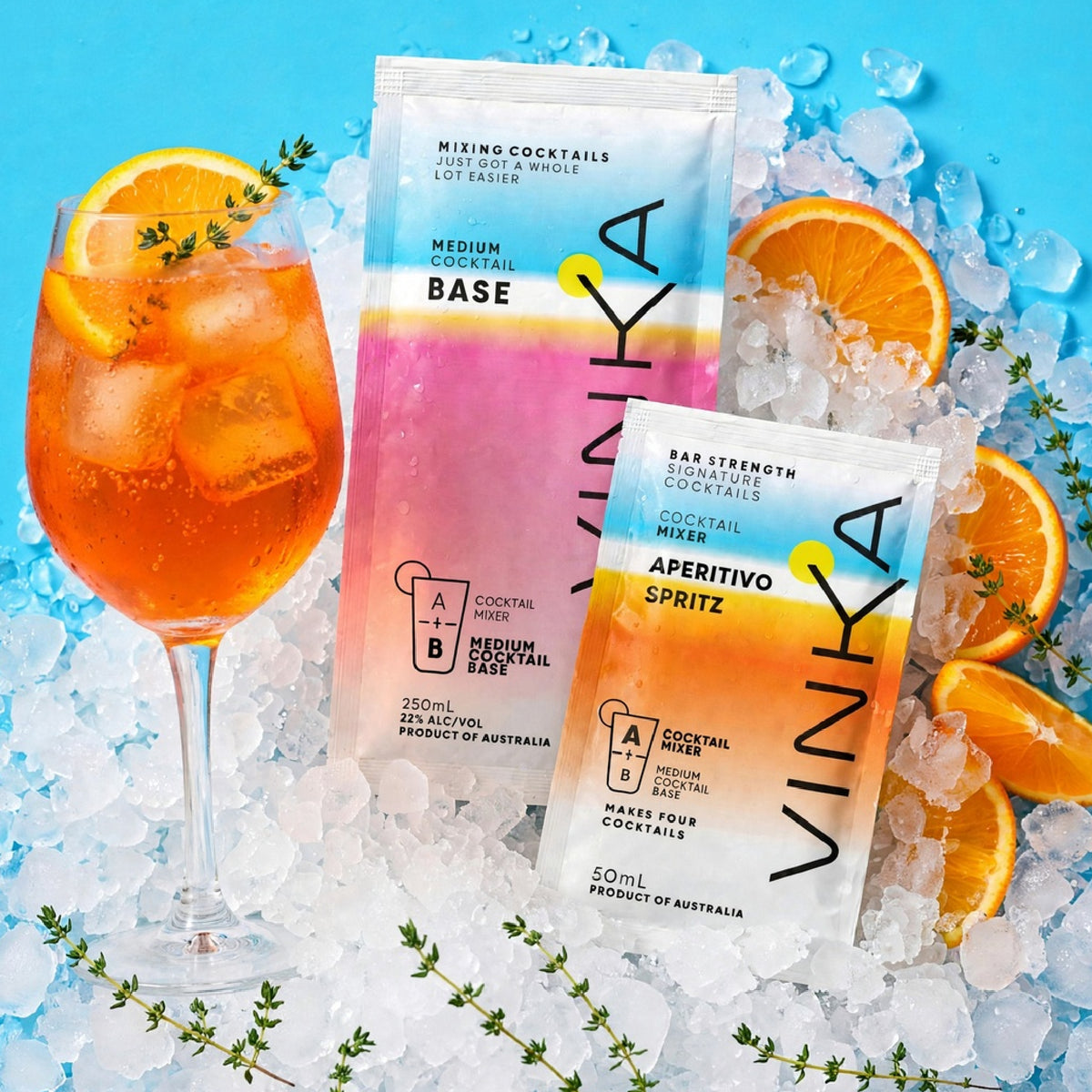 Aperitivo Spritz VINKA Two Sachet Mixer pack on a bed of ice with Oranges and Thyme.
