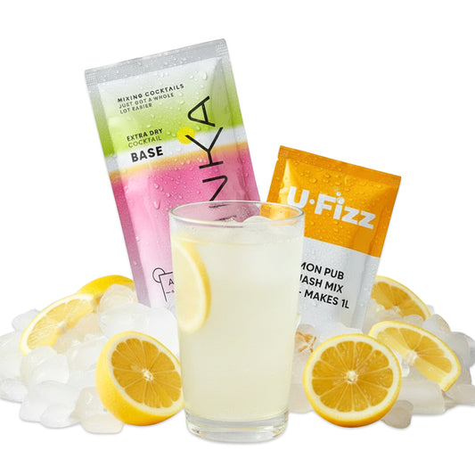Two packets of U-Fizz drink mix with a glass of lemonade and lemon slices on a white background